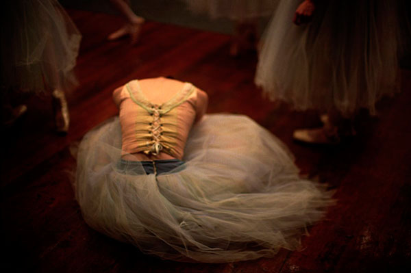 Photograph Jim Erickson A Delicate Ballerina Stretching On The Floor on One Eyeland