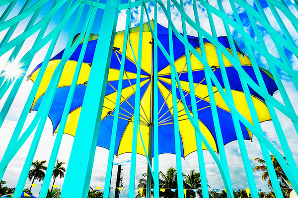 Photograph Mitchell Funk Yellow And Blue Umbrella on One Eyeland
