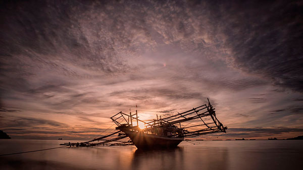 Photograph Heri Budianto Sunset And Boat on One Eyeland