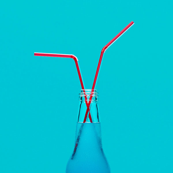 Photograph Marc Tule Red Straw Bottle on One Eyeland