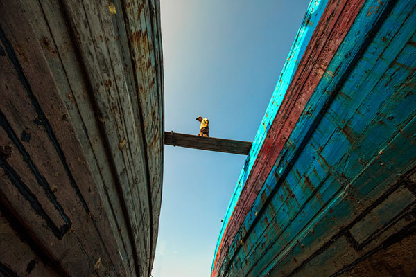Photograph Hendry Chen Walking In Big Shipyard on One Eyeland