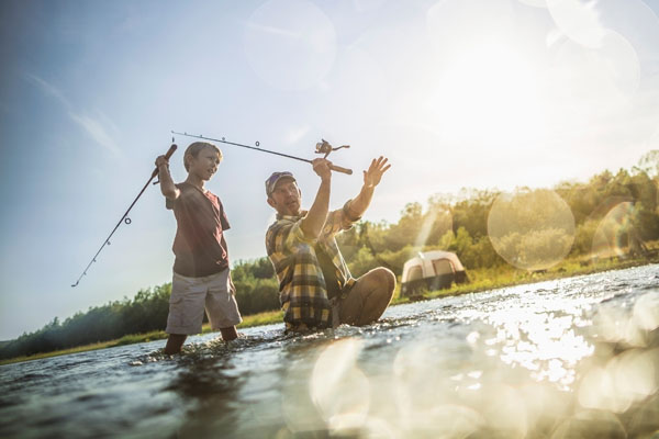 Photograph Fedele Studio Father Teaching To Cast On Fishing Trip on One Eyeland