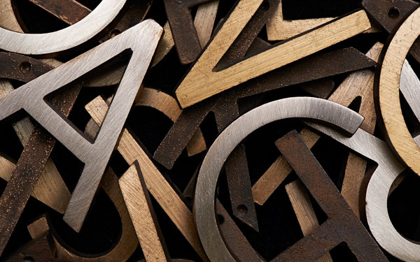 Photograph Mark Wiens Brass Sign Letters on One Eyeland