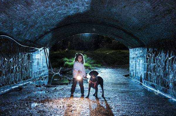 Photograph Ben Welsh Girl And Dog In A Tunel on One Eyeland