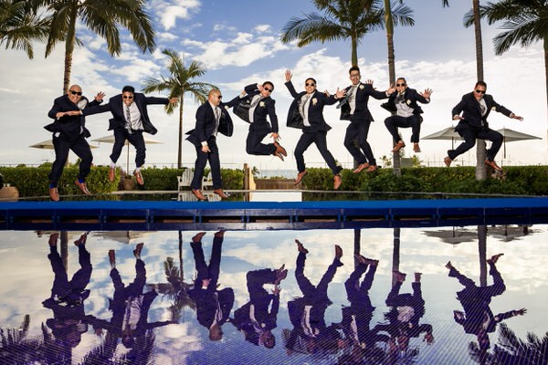 Photograph Vicens Forns Jumping Groomsmen on One Eyeland