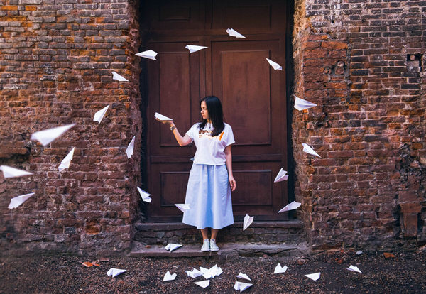 Photograph Olga Paratinskaya Girl And Paper Airplanes on One Eyeland