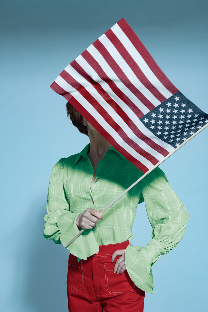 Photograph Kremer Johnson Standing Behind The Flag on One Eyeland