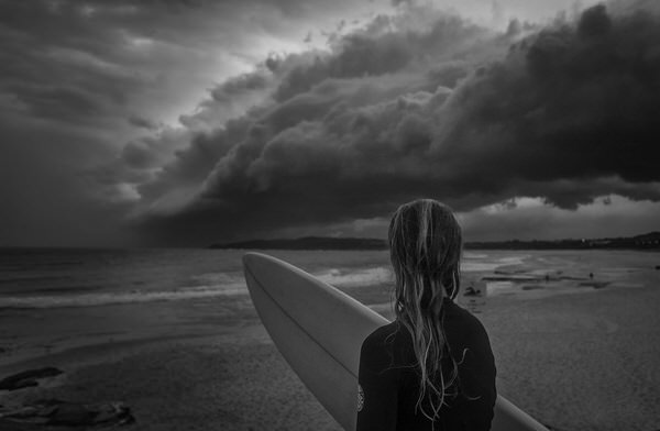 Photograph Steve Turner Surfer In Storm on One Eyeland