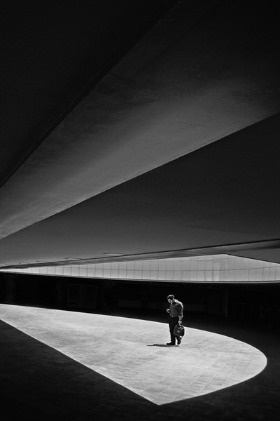 Photograph Mohammad Dadsetan Walking Cellphone on One Eyeland