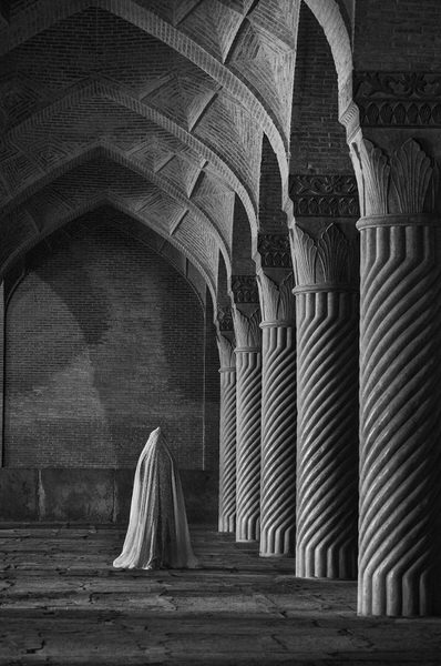 Photograph Farshid Ashkarr Woman Standing Between Old Columns on One Eyeland