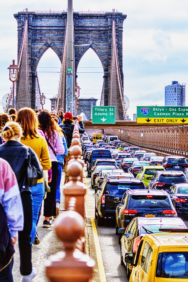 Photograph Mitchell Funk Crowds And Traffic On The Brooklyn Bridge on One Eyeland
