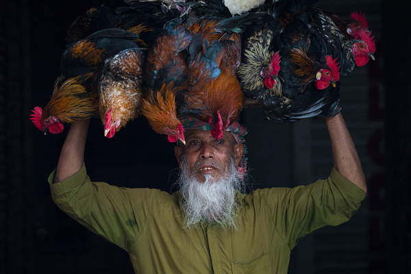 Photograph Azim Khan Ronnie Cock Seller on One Eyeland