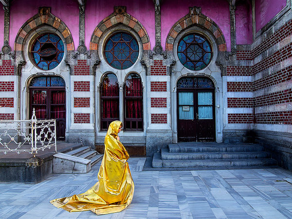 Photograph Tuncay Demir Woman In Yellow Dress In Front Of Sirkeci Station on One Eyeland