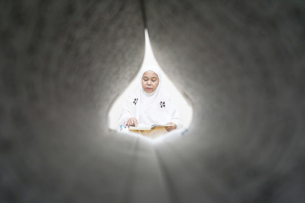 Photograph Andaru Firmansyah A Mother Reading The Quran on One Eyeland