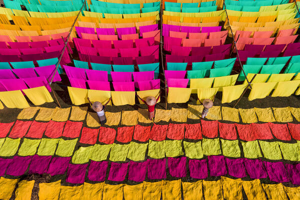 Photograph Sujon Adikary Drying Colorful Clothes on One Eyeland