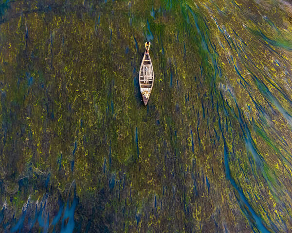 Photograph Sujon Adikary Travelling Through Algae River on One Eyeland