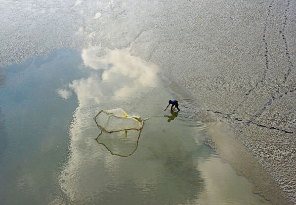 Photograph Chinmoy Biswas Casting The Net on One Eyeland