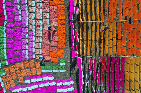 Photograph Sujon Adikary Drying Cloth Under Hot Sun on One Eyeland