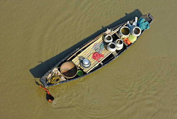 Photograph Chinmoy Biswas Man With The Boat on One Eyeland