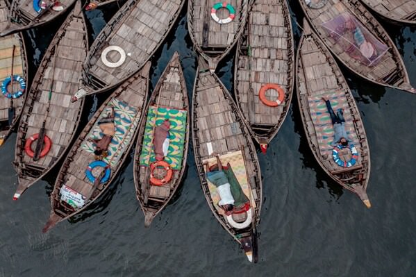 Photograph Rakibul Alam Khan Sleep In The Boat on One Eyeland