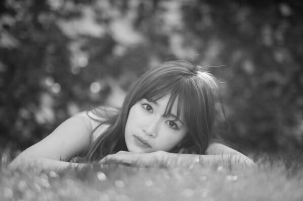 Photograph Setsuna Kurouzu Woman Lying On The Grass on One Eyeland