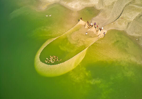 Photograph Azim Khan Ronnie Fishing With Big Net on One Eyeland