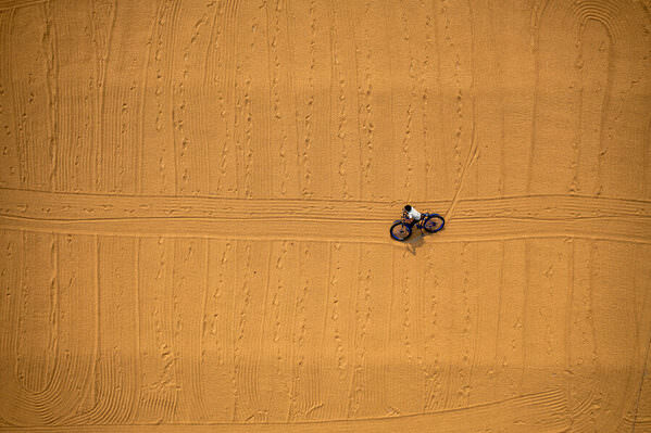 Photograph Azim Khan Ronnie Bicycle On Drying Rice on One Eyeland
