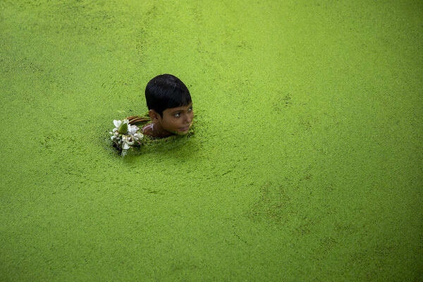 Photograph Azim Khan Ronnie A Boy In The Pond on One Eyeland