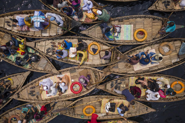Photograph Azim Khan Ronnie Boats Of Workers on One Eyeland
