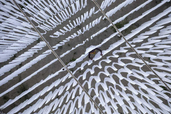 Photograph Azim Khan Ronnie Drying White Cloths on One Eyeland