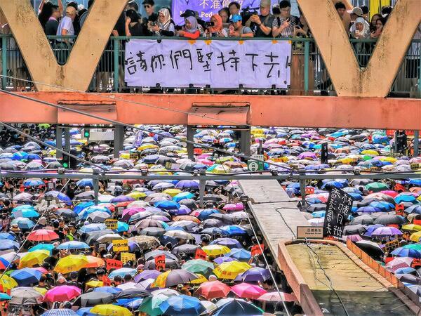 Photograph Howard Tong Demonstrators Holding Umbrellas on One Eyeland