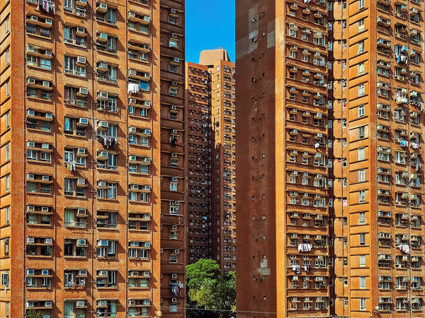 Photograph Howard Tong Between Tall Buildings on One Eyeland