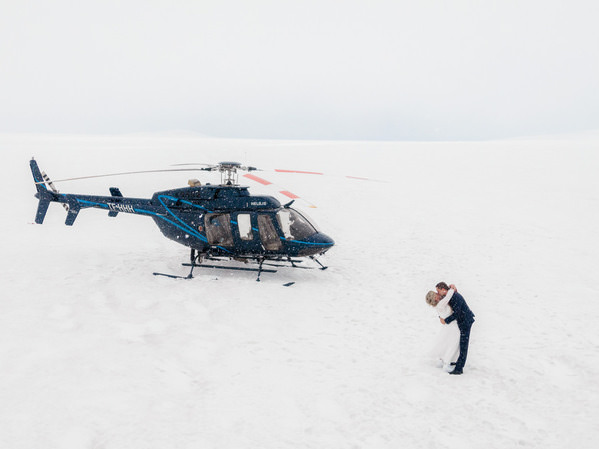 Photograph Iceland Wedding Photo Kiss And A Helicopter on One Eyeland