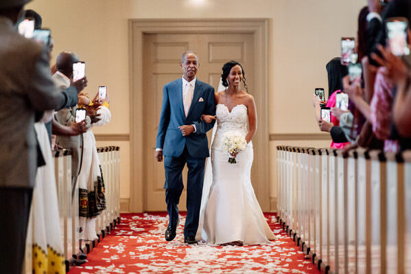 Photograph Jason Montoya Bride Walking Down The Aisle on One Eyeland