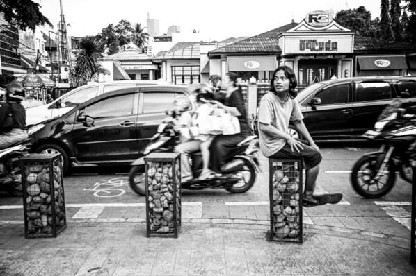 Photograph Noor Kasmara Mohd Sokarnor Looking Out For Customers Near Cikini Street on One Eyeland