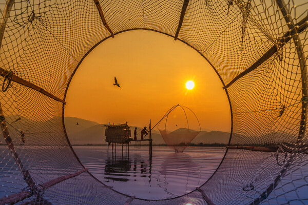 Photograph Kyaw Zay Yar Lin Fishing Under The Sunrise Time on One Eyeland