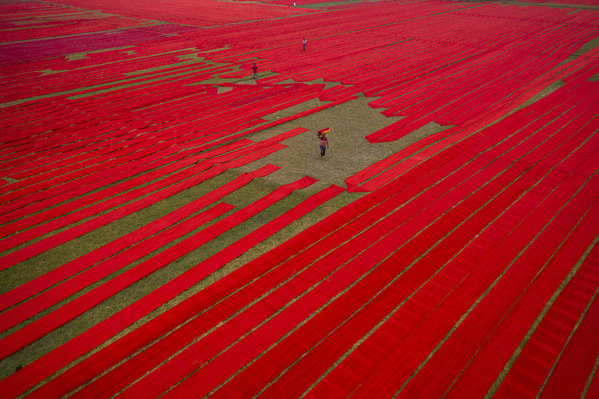 Photograph Azim Khan Ronnie Drying Red Cloths on One Eyeland