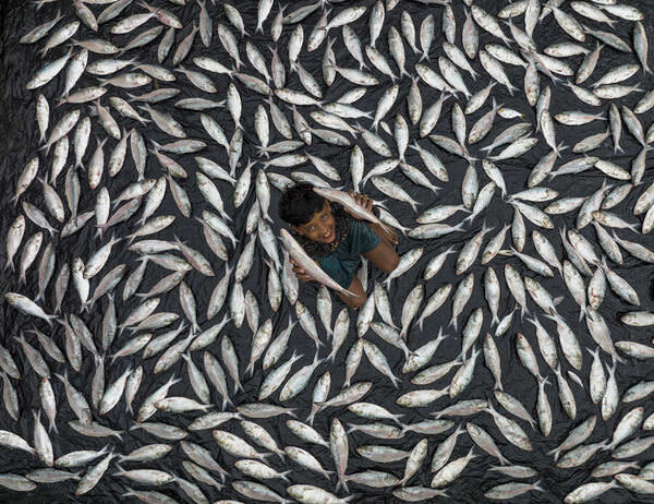Photograph Azim Khan Ronnie Fish Boy on One Eyeland
