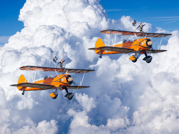 Photograph Claude Bossel Flying With The Breitling Wings Walkers on One Eyeland