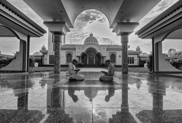 Photograph Azim Khan Ronnie Reading Holy Quran on One Eyeland