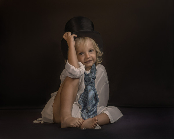 Photograph Lyudmyla Pokryshen Little Boy With A Top Hat on One Eyeland