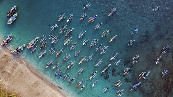 Photograph Laimute Kuriene Iconic Fishing Boats At Papuma Beach on One Eyeland