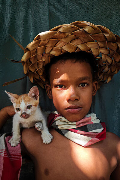 Photograph Phyo Kyaw The Boy And His Kitten on One Eyeland