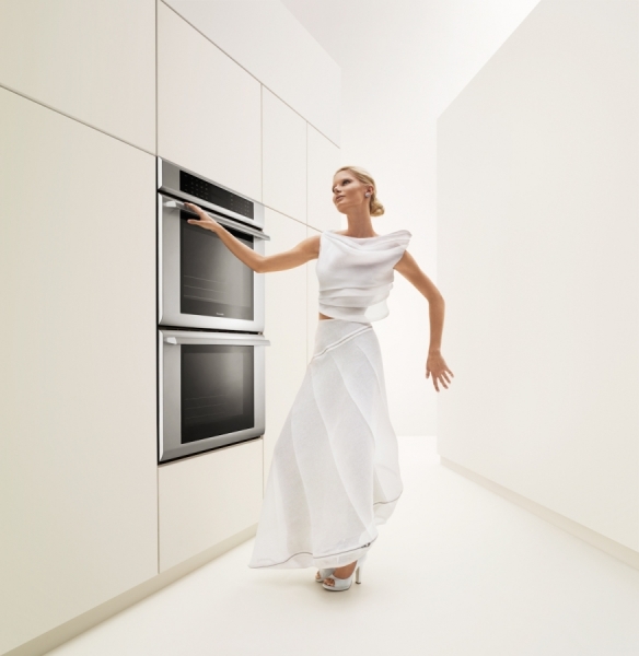 Photograph Stan Musilek Woman In White Kitchen on One Eyeland