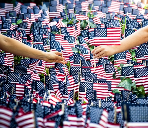 Photograph Kevin Steele Hands And Flags on One Eyeland
