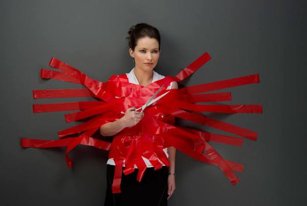 Photograph Ann Cutting Red Tape on One Eyeland