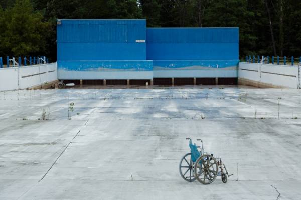 Photograph Eric Prine Abandoned Wheel Chair on One Eyeland