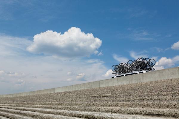 Photograph Eric Prine Carrying Bikes on One Eyeland