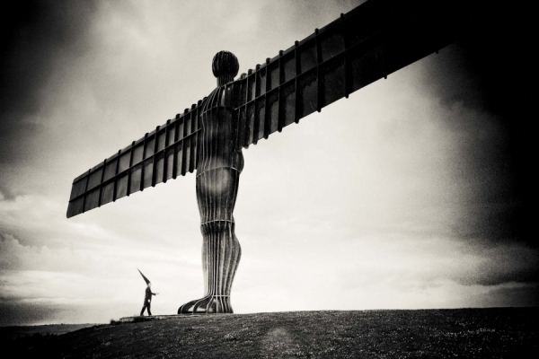 Photograph Laurence Winram Coneman With The Angel Of The North on One Eyeland