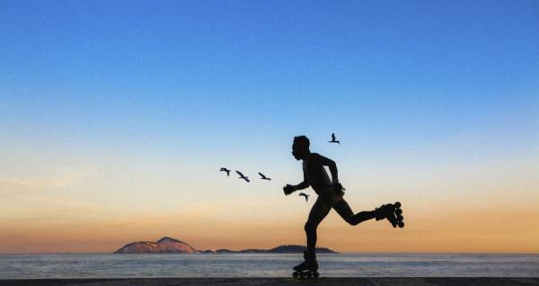 Photograph Richard Romero Skating At Ipanema Beach on One Eyeland